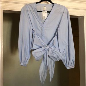 Wrap look top with puffed sleeves